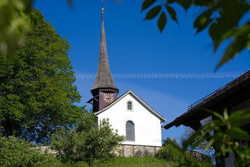 Fototapeta na wymiar Old protestant church of Zurich Witikon on a hill at springtime. Photo taken May 28th, 2021, Zurich, Switzerland.