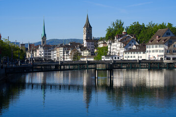 Fototapeta na wymiar Old town of Zurich with river Limmat at morning at springtime with beautiful reflections. Photo taken May 28th, 2021, Zurich, Switzerland.