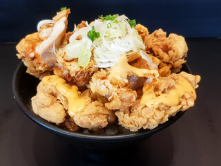 Fried chicken with mayonnaise sauce and rice on dish background