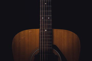 Fototapeta na wymiar Sound board and neck of old acoustic guitar and dark tone vintage filter
