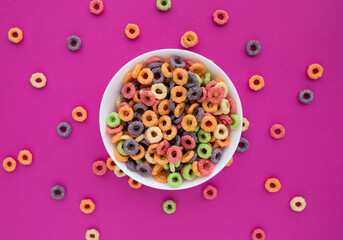 multicolored bright dry breakfast on pink background