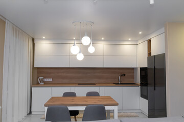 Beautiful modern minimalistic interior of a bright kitchen