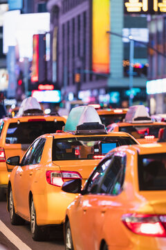 Row of yellow cabs in Times Square