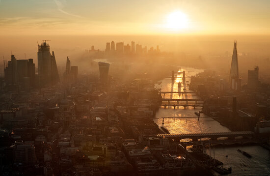UK, London, Aerial view of city and Thames river at sunset