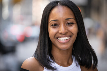 Young black woman in city smile happy face portrait