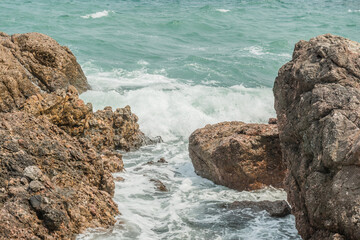 Waves crashing on the rocks.