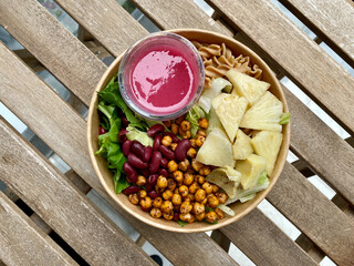 Healthy Organic Food Bowl with Roasted Chickpea, Pineapple, Fusilli Pasta and Cherry Sauce. Take Away