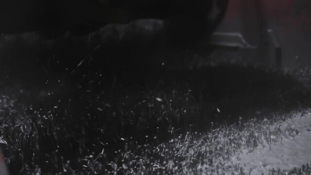 Oil rig shale shaker separating cuttings from drilling mud in slow motion