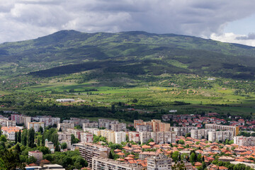 Fototapeta na wymiar City view from above, landscape, small city and mountain