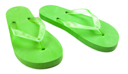 green rubber flip flops on a white background, isolate