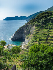 cliff rock on sea and gulf in Cinque Terre National Park in Italy in city.