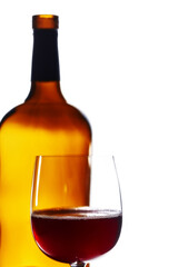 Close-up of glass with red wine and wine bottle. All dust and scratches has been removed. Isolated on white