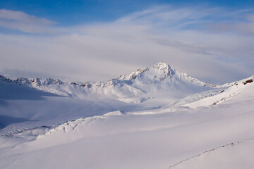 Fototapeta na wymiar Mountains covered with snow. Elbrus region, Russia.