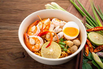 instant noodles tomyumkung.thai spicy food with herb
