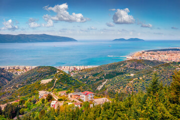 Aerial spring cityscape of Vlore city from Kanines fortress. Impressive morning sescape of Adriatic sea. Splendid outdoor scene of Albania, Europe. Traveling concept background..