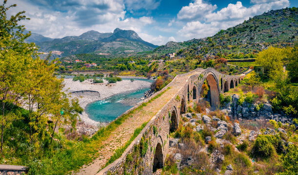 Attractive spring view of Old Mes Bridge. Majestic morning landscape of Shkoder. Wonderful outdoor scene of Albania, Europe. Traveling concept background.