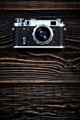 Close-Up Of Vintage Camera on old wooden table