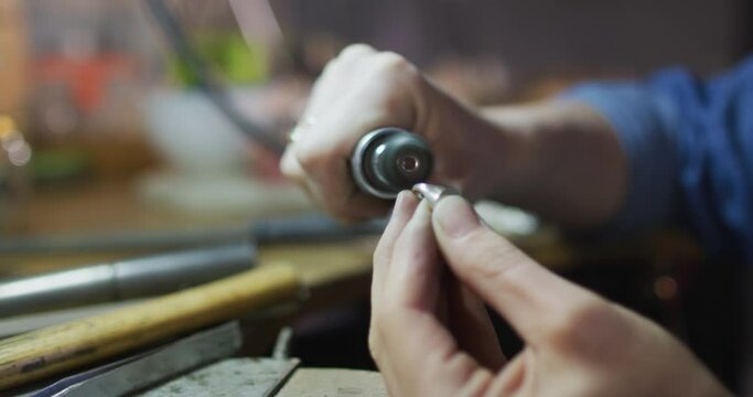 Close Up Of Hands Of Caucasian Female Jeweller Using Tools, Making Jewelry