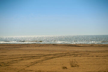 Sand beach. Sea shore. Sunny day.