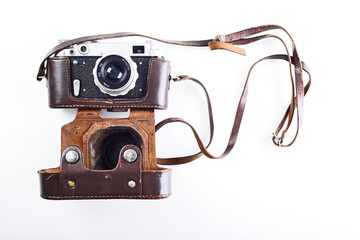 The 50s vintage photo camera on light background