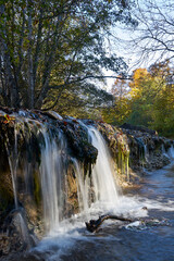 Fototapeta premium Image of an oil stain in a mountain stream.