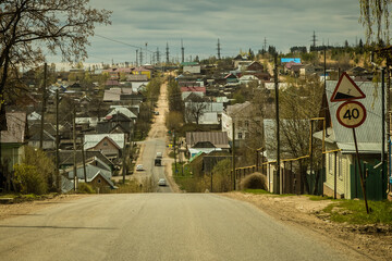 Fototapeta premium federal highway passes through a small provincial town with old wooden houses
