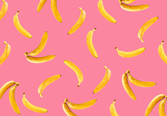 Ripe bananas on a pink background. Bananas pattern.
