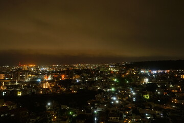Obraz premium Aerial view of Naha city at night in Okinawa, Japan - 沖縄 那覇 夜景