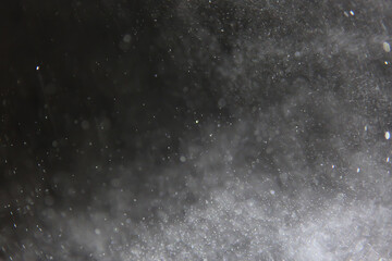 abstract background overlay white bokeh falling snow fog view on black