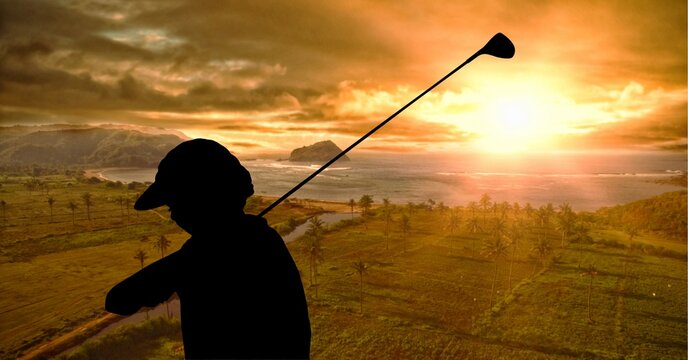 Composition of silhouette of golf player over landscape with copy space