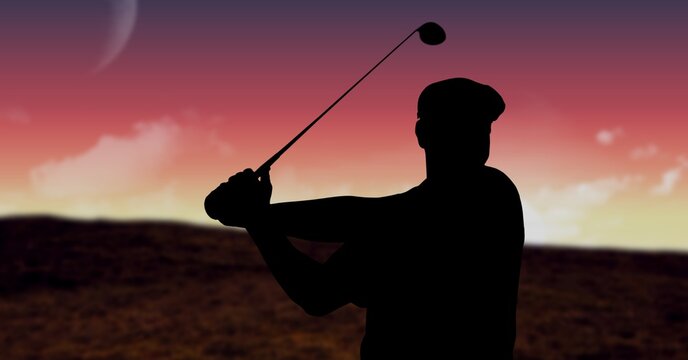 Composition of silhouette of male golf player over landscape and pink sky with copy space