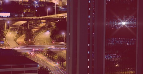 Composition of network of light trails and connections over cityscape