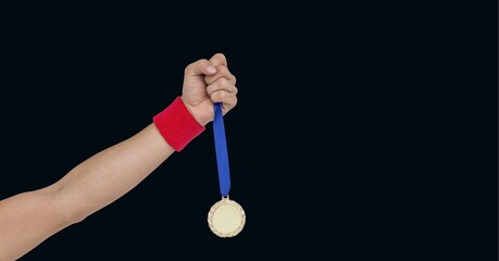 Composition of caucasian male athlete holding gold medal with copy space on black background