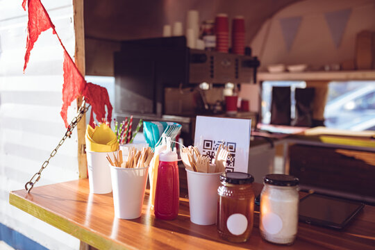 Close up view of food truck with condiments and red bunting