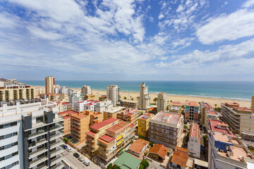 High angle panoramic view of urban beach in the Mediterranean Spanish coast. Playa de Gandia, Valencia, Spain