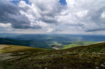 Obraz na płótnie Canvas Mountain panoramic landscape with clouds and blue sky