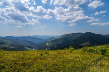 Mountain panoramic landscape with clouds and blue sky