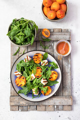 grilled apricot salad with halloumi cheese and arugula