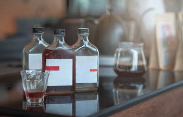 Cold brewed coffee in a glass bottle is placed on the table.