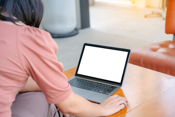 Cropped image of professional businesswoman working at her office via laptop, young female manager using portable computer device.