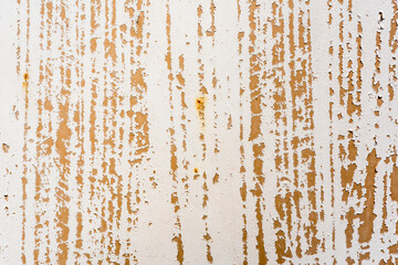 Fototapeta premium Background of rusty metal wall covered with paint peeling off