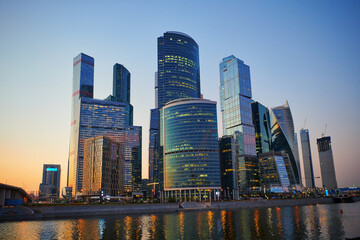 Plakat Urban landscape of Moscow-city, downtown business center with tall buildings. Skyscrapers in light sunset and blue sky at evening. Moscow. Russia.