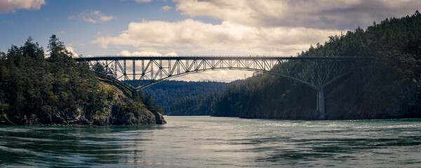The Deception Pass Bridge connection Anacortes Island with Whidbey Island in Washington state in daylight.