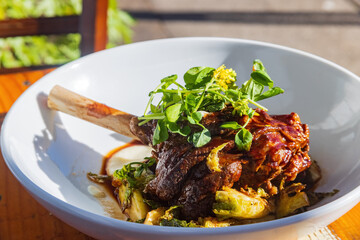 Close up shot of slow cooked braised Lamb Shanks