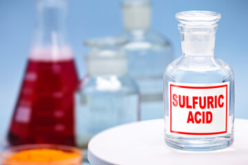 Reagent bottle in laboratory with description: Sulfuric acid.