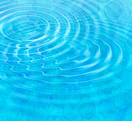 Blue abstract background with water ripples and bubbles