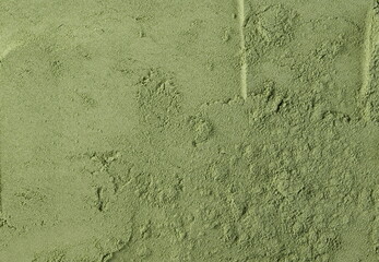 Organic powder wheat grass background and texture, top view