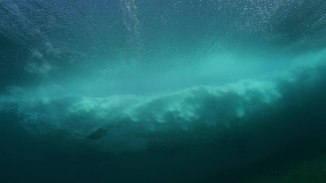 Close-Up Shot Of Carefree Surfer Surfing In Sea, Waves Splashing Underwater - Oahu, Hawaii