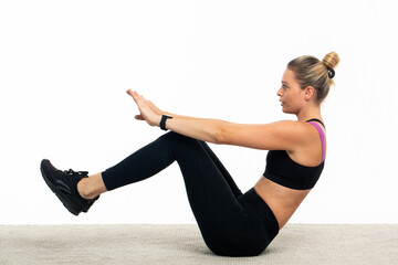 Young woman in sportswear train abs 