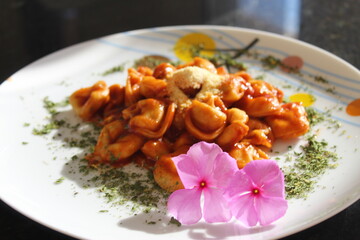 Capeletti, pasta, tomato sauce.